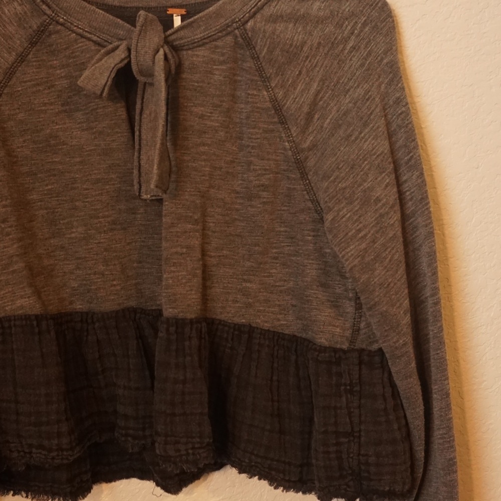Free People cropped long sleeve top with bow and gauze detail at trim.